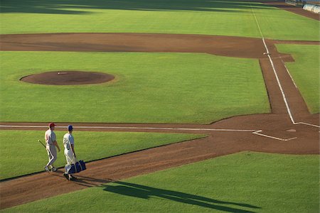Baseball Players Walking in Field Stock Photo - Premium Royalty-Free, Code: 622-02621677