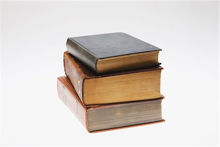 dictionary - Stack of Second-Hand Books on White Background Stock Photo - Premium Royalty-Free, Code: 622-02758781