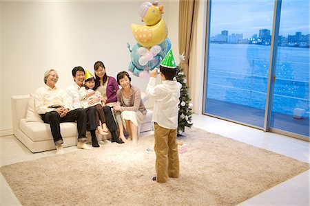 elder care - Child taking snap of his family Stock Photo - Premium Royalty-Free, Code: 622-02759100