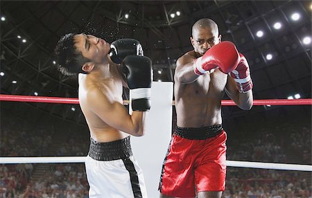 Two men Boxing with one being hit Stock Photo - Premium Royalty-Free, Code: 622-02913209