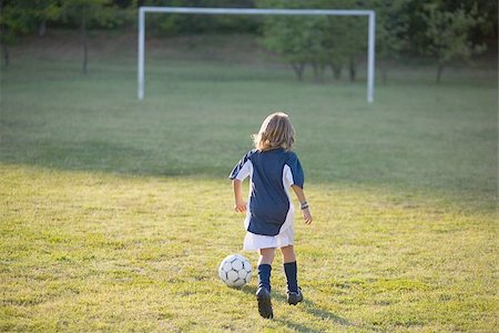 Soccer Boy Running towards Goal Stock Photo - Premium Royalty-Free, Code: 622-02913348