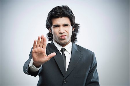 simsearch:6107-06117573,k - Businessman showing stop gesture Stock Photo - Premium Royalty-Free, Code: 630-06724719