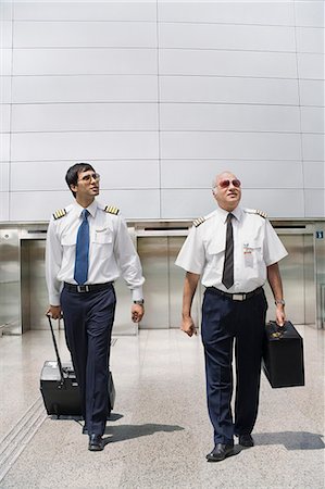 simsearch:630-03479530,k - Two pilots carrying their luggage at an airport Stock Photo - Premium Royalty-Free, Code: 630-06721845