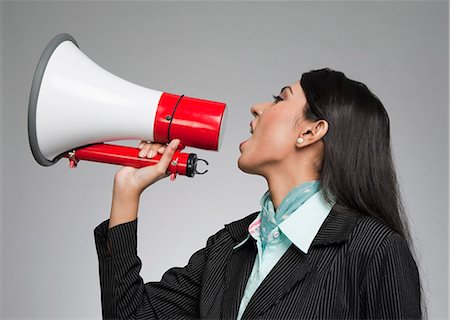 speaker (audio equipment) - Businesswoman shouting into a megaphone Stock Photo - Premium Royalty-Free, Code: 630-06721994
