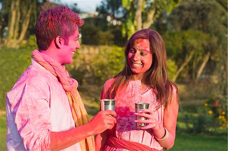 ethnic culture of india - Couple celebrating Holi with glass of bhang Stock Photo - Premium Royalty-Free, Code: 630-06722106