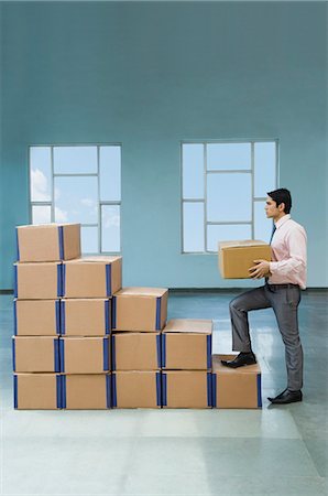 simsearch:630-06723923,k - Businessman stacking cardboard boxes in shape of rising bar graph Stock Photo - Premium Royalty-Free, Code: 630-06722223