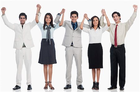 people lining up on white background - Business executives celebrating their success Stock Photo - Premium Royalty-Free, Code: 630-06722385