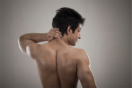 shirtless teen boy - Muscular man suffering from neckache Stock Photo - Premium Royalty-Free, Code: 630-06722673