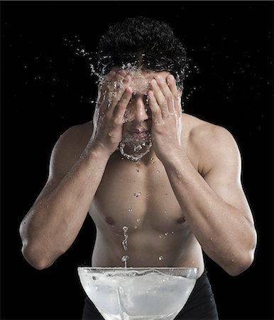 shirtless teen boy - Man washing face Stock Photo - Premium Royalty-Free, Code: 630-06722695