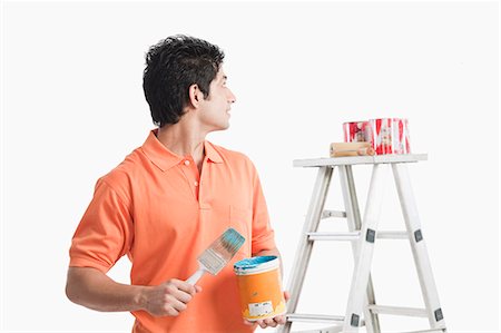 step ladder - Man holding a paint can Stock Photo - Premium Royalty-Free, Code: 630-06722723