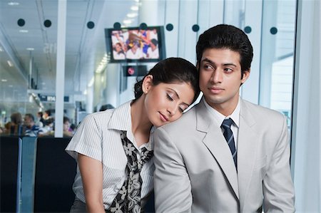 Business couple at an airport lounge Stock Photo - Premium Royalty-Free, Code: 630-06722770