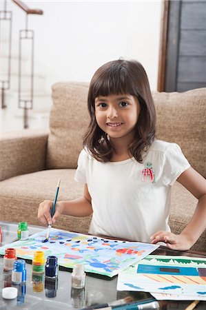 Portrait of a girl painting Stock Photo - Premium Royalty-Free, Code: 630-06722974