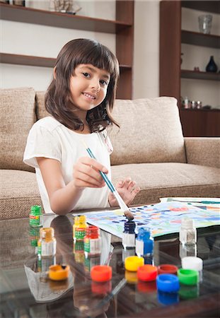 Portrait of a girl painting Stock Photo - Premium Royalty-Free, Code: 630-06722979