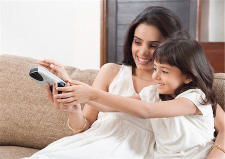 simsearch:649-07239830,k - Woman watching television with her daughter Stock Photo - Premium Royalty-Free, Code: 630-06722986