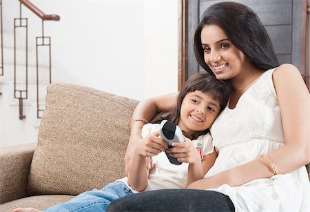 simsearch:649-07239830,k - Woman watching television with her daughter Stock Photo - Premium Royalty-Free, Code: 630-06722987