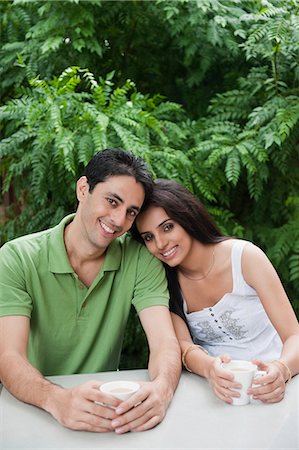 Couple drinking tea in a lawn Stock Photo - Premium Royalty-Free, Code: 630-06723110