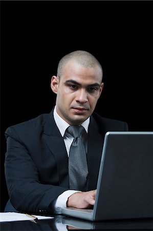 simsearch:6113-06753440,k - Businessman working on a laptop Stock Photo - Premium Royalty-Free, Code: 630-06723199