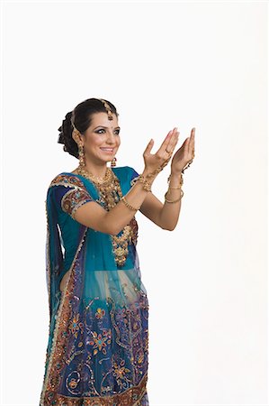 Woman gesturing at Diwali festival Photographie de stock - Premium Libres de Droits, Code: 630-06723553