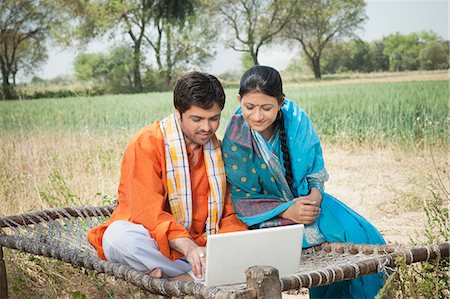 saree couples - Rural couple using a laptop, Sohna, Haryana, India Stock Photo - Premium Royalty-Free, Code: 630-07071132