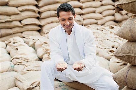 Man showing wheat grains, Anaj Mandi, Sohna, Gurgaon, Haryana, India Stock Photo - Premium Royalty-Free, Code: 630-07071173