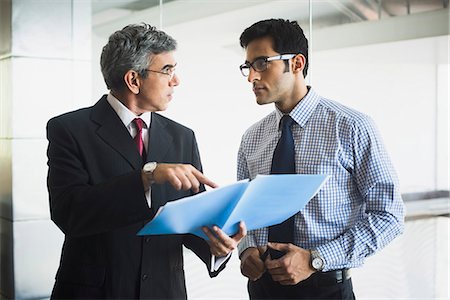 simsearch:630-07071502,k - Business men discussing a document Stock Photo - Premium Royalty-Free, Code: 630-07071447
