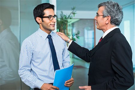 simsearch:630-07071502,k - Boss talking with his employee in an office Stock Photo - Premium Royalty-Free, Code: 630-07071452
