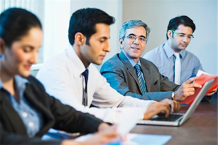 simsearch:630-07071502,k - Businessman in a meeting with colleagues Stock Photo - Premium Royalty-Free, Code: 630-07071484