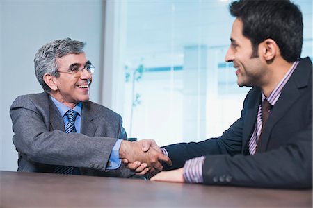 simsearch:630-07071502,k - Businessman shaking hands with another businessman Stock Photo - Premium Royalty-Free, Code: 630-07071494