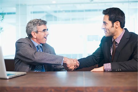 simsearch:630-07071502,k - Businessman shaking hands with another businessman Stock Photo - Premium Royalty-Free, Code: 630-07071492