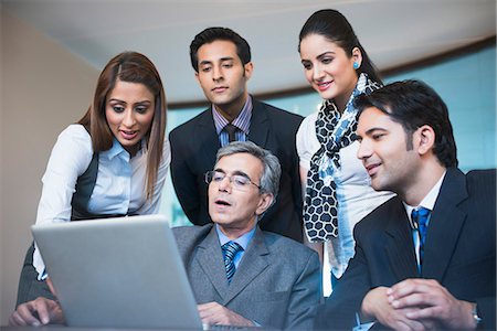 simsearch:630-07071502,k - Business executives working on a laptop Stock Photo - Premium Royalty-Free, Code: 630-07071506