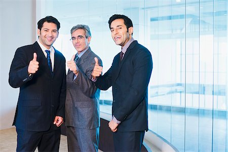 simsearch:630-07071502,k - Businessmen showing thumbs up Stock Photo - Premium Royalty-Free, Code: 630-07071503