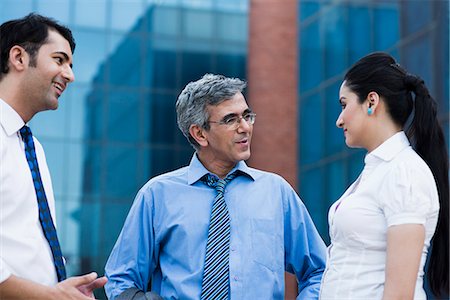 simsearch:630-07071502,k - Business executives discussing outside an office building Stock Photo - Premium Royalty-Free, Code: 630-07071521