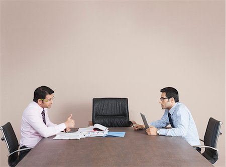 simsearch:630-07071502,k - Business executives talking to each other in office Stock Photo - Premium Royalty-Free, Code: 630-07071537