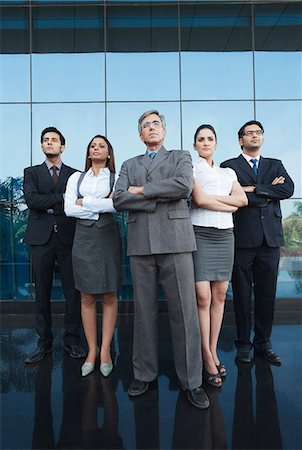 Business people standing together with their arms crossed Stock Photo - Premium Royalty-Free, Code: 630-07071584