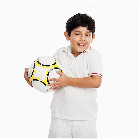 simsearch:630-07071771,k - Boy holding a football Stock Photo - Premium Royalty-Free, Code: 630-07071807