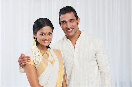 saree couples - Portrait of a South Indian couple smiling Stock Photo - Premium Royalty-Free, Code: 630-07071848
