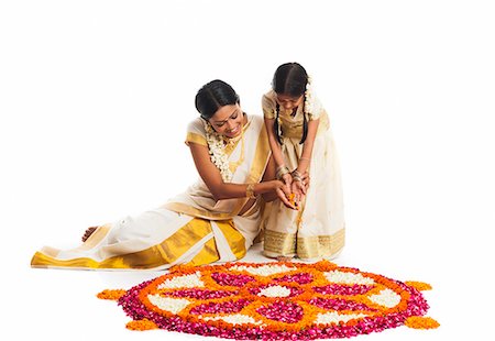 flower for mom asian - South Indian woman making a rangoli of flowers with her daughter at Onam Stock Photo - Premium Royalty-Free, Code: 630-07071856