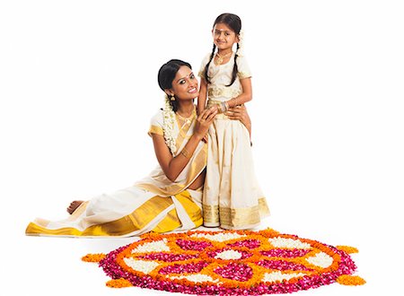flower for mom asian - South Indian woman making a rangoli of flowers with her daughter at Onam Stock Photo - Premium Royalty-Free, Code: 630-07071857