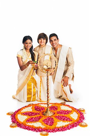 saree couples - South Indian family standing near rangoli of flowers at Onam Stock Photo - Premium Royalty-Free, Code: 630-07071865
