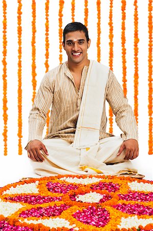 simsearch:700-00195618,k - South Indian man sitting near a rangoli of flowers at Onam Stock Photo - Premium Royalty-Free, Code: 630-07071877