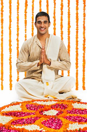 simsearch:700-00195618,k - South Indian man greeting near rangoli of flowers at Onam Stock Photo - Premium Royalty-Free, Code: 630-07071878