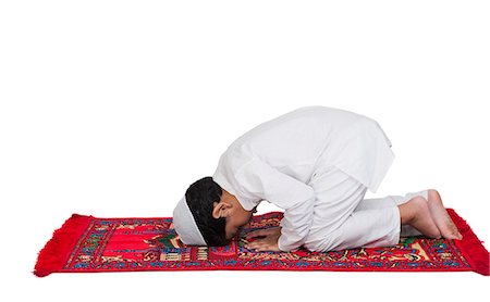 Muslim boy praying Stock Photo - Premium Royalty-Free, Code: 630-07071923