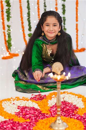 Girl making rangoli on Diwali Stock Photo - Premium Royalty-Free, Code: 630-07071947