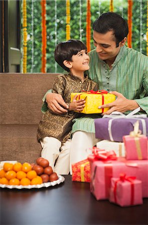 simsearch:700-00195618,k - Man and his son celebrating Diwali Stock Photo - Premium Royalty-Free, Code: 630-07071978