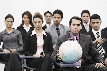 people connected globe - Portrait of a group of business executives sitting in a meeting Stock Photo - Premium Royalty-Free, Code: 630-01076169