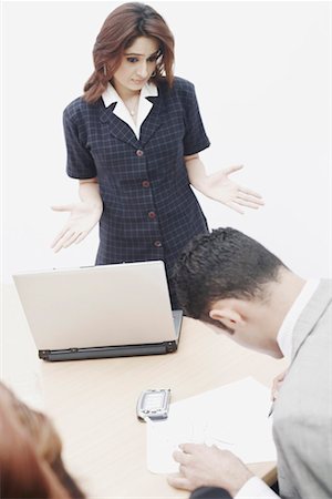 phone with indian man backside - High angle view of a businesswoman looking at a businessman Stock Photo - Premium Royalty-Free, Code: 630-01076234