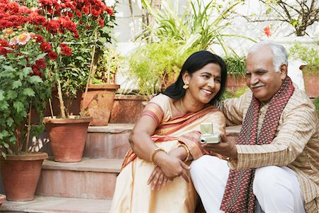 simsearch:630-01076466,k - Close-up of a mature couple sitting on steps Stock Photo - Premium Royalty-Free, Code: 630-01076458