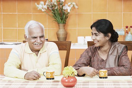 simsearch:630-01076466,k - Mature couple having tea at the dining table Stock Photo - Premium Royalty-Free, Code: 630-01076542