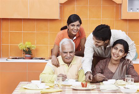 simsearch:630-01076466,k - Portrait of a mature couple and their two children at the dinning table Stock Photo - Premium Royalty-Free, Code: 630-01076555