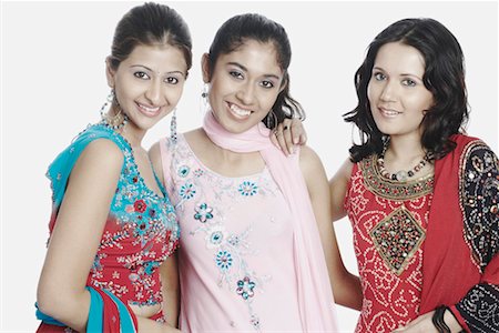 simsearch:700-00524621,k - Portrait of three young women smiling Stock Photo - Premium Royalty-Free, Code: 630-01077614